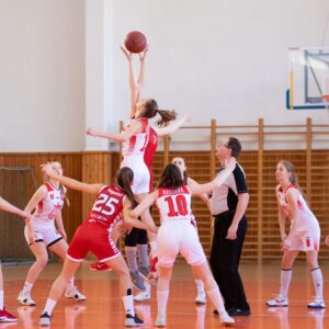 woman players playing basketball