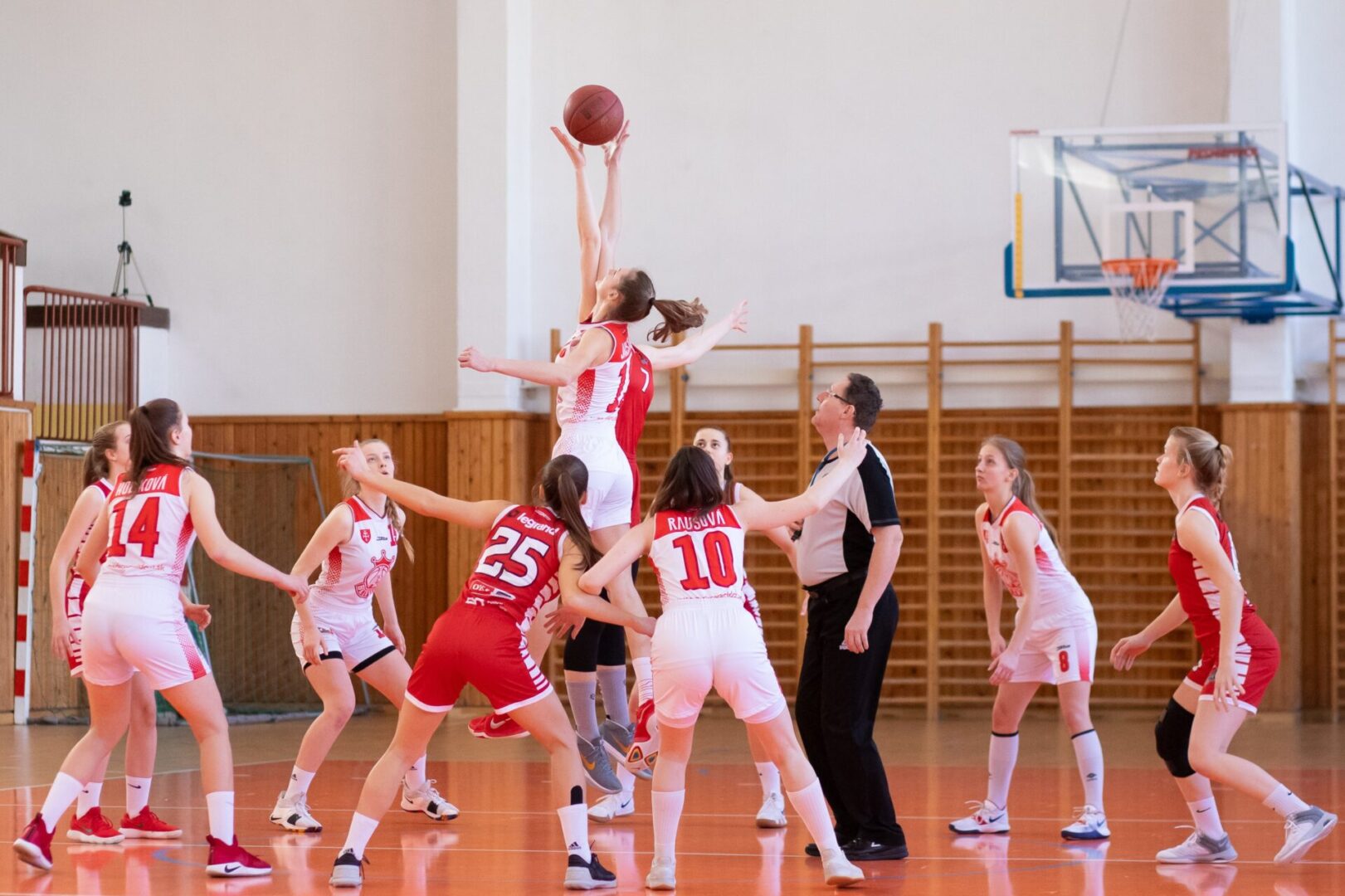 woman players playing basketball