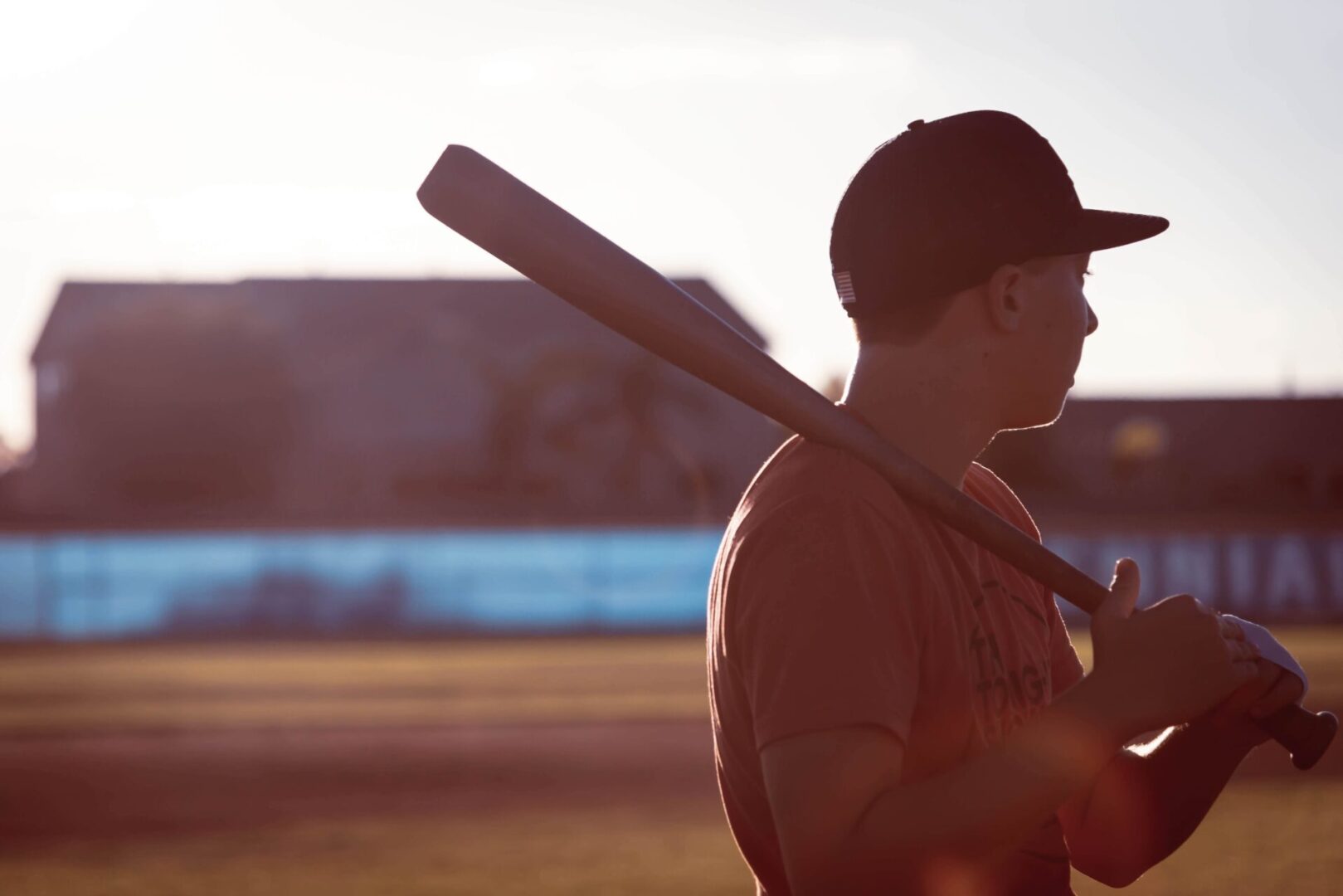 a silhoutte of a baseball player holding a bat